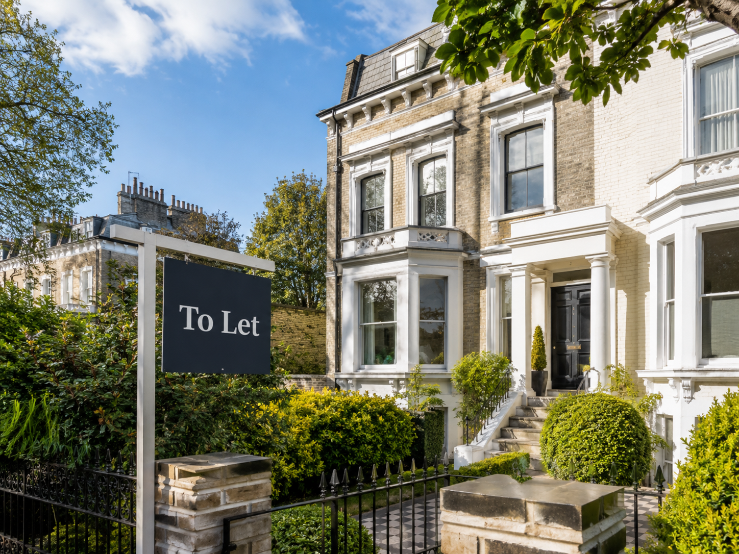 A period townhouse with a To Let sign at the front